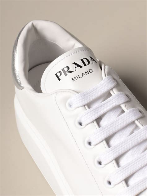 white prada sneakers.